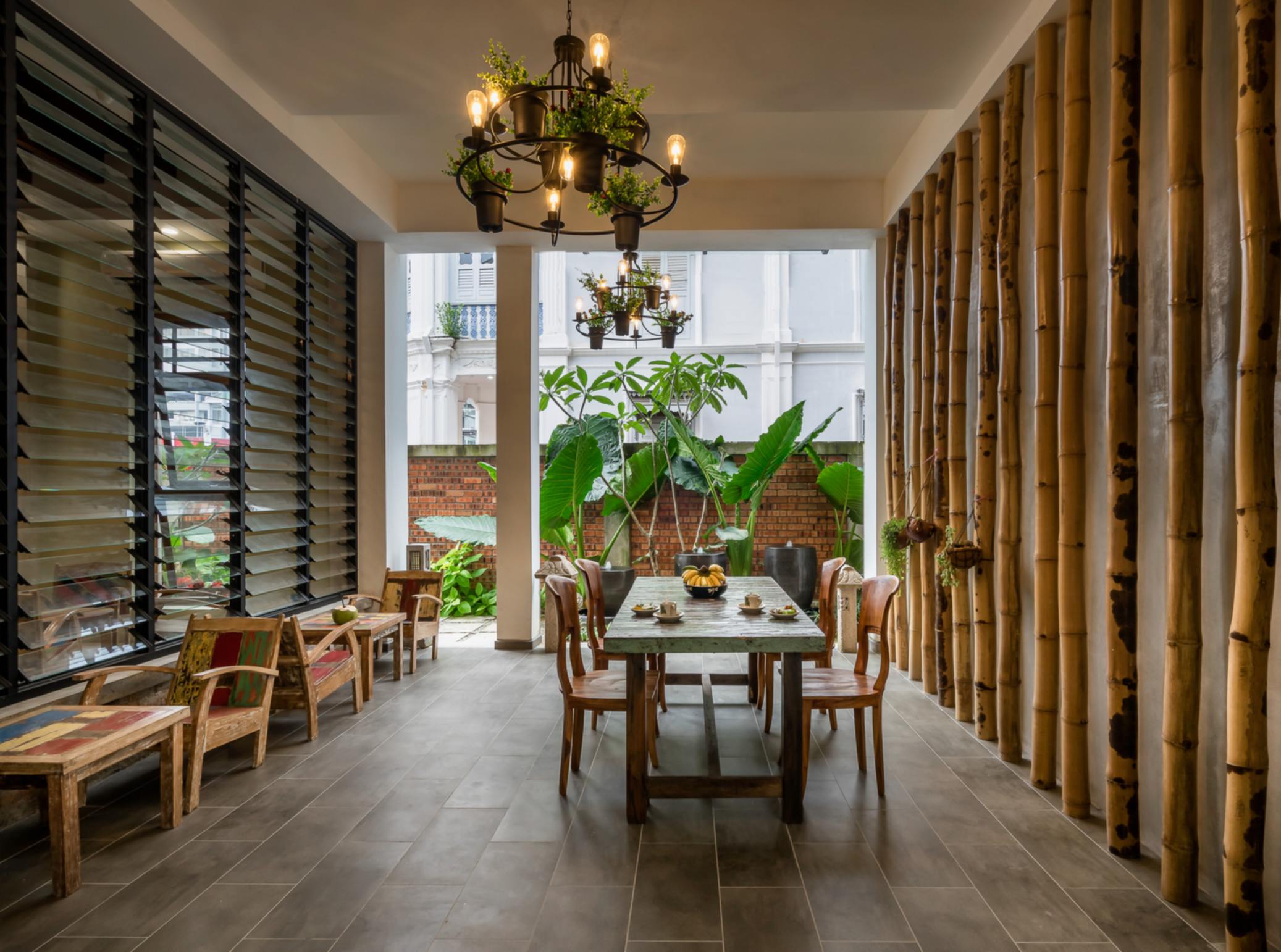 Heritage lobby with bamboo columns and chandelier
