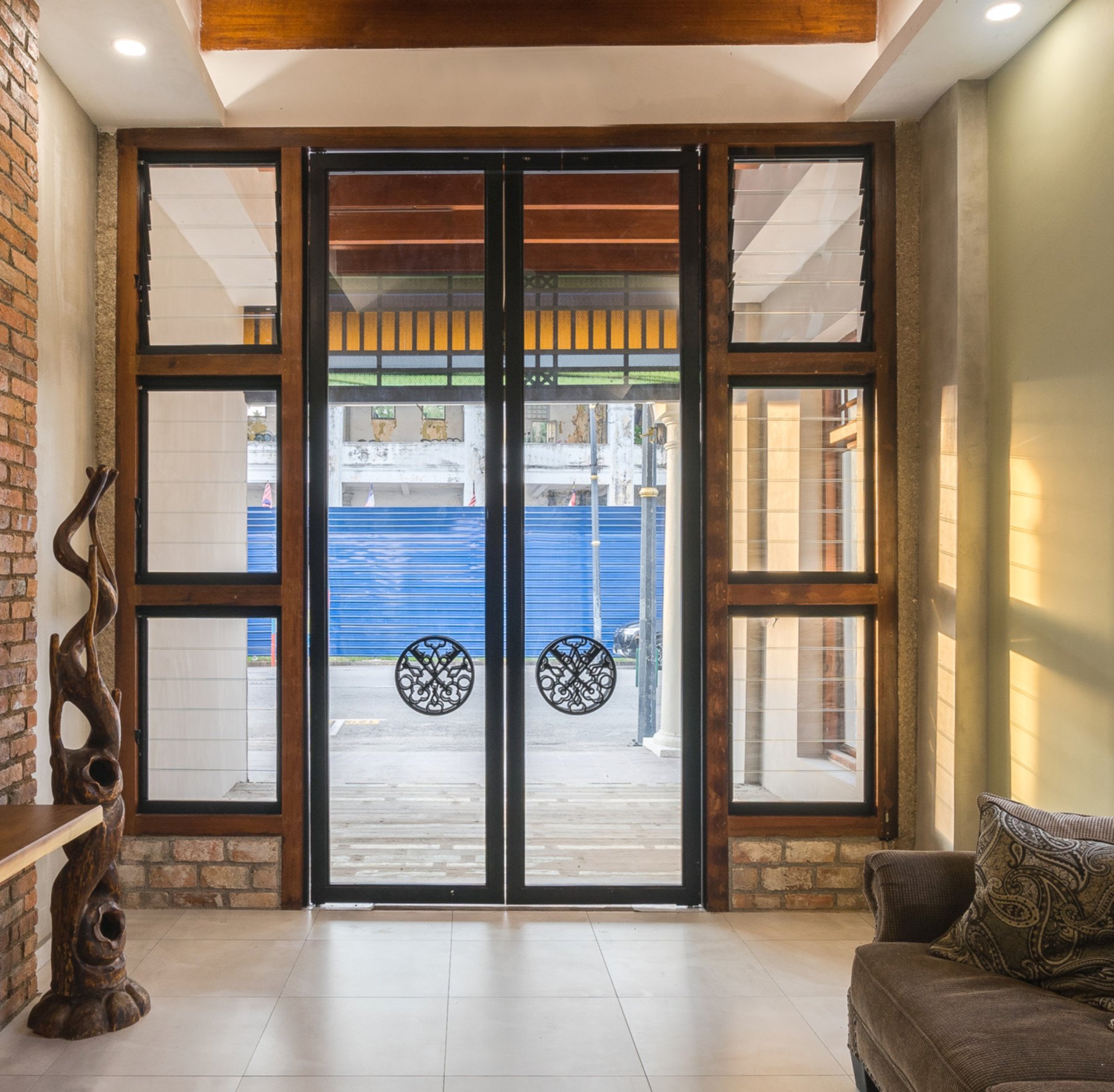 Lobby area with heritage furniture and warm lighting